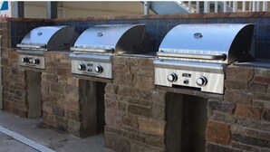 A row of outdoor grills built into a stone wall. - Lotus Inn - Overview Townhouse - 2 Bedroom (Wildwood Crest)