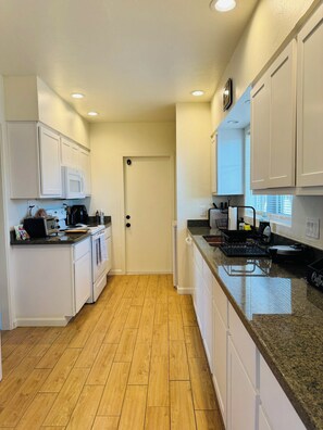 Microwave, oven, stovetop, dishwasher - Midcentury 2-Bedroom Home Near University of Arizona (Tucson)