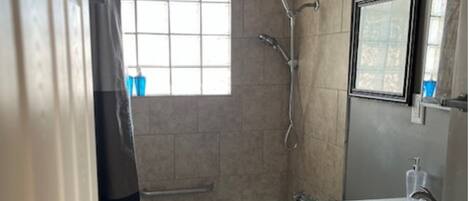Shower, hair dryer, towels, soap