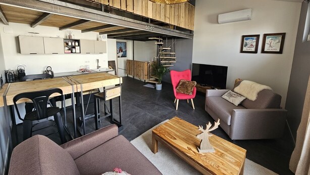 A modern loft apartment with a kitchen, dining area, and living room. - Le Chalet-Loft-Private Bathroom-Apartment-Garden view (Genas)