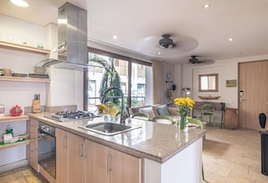 Apartment, Garden View | Private kitchen | Fridge, microwave, oven, stovetop - Luxury Boutique Apartments by Xarm Apartments (Santa Marta)