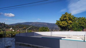 A rooftop pool with a clear view of the surrounding landscape. - Walnut House with Private Pool (Gondufe)