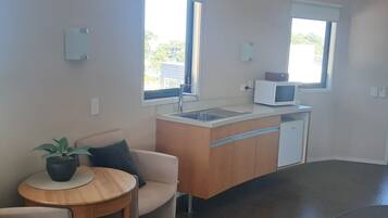 Deluxe Suite, Beach View | Laptop workspace, blackout drapes, iron/ironing board, free WiFi