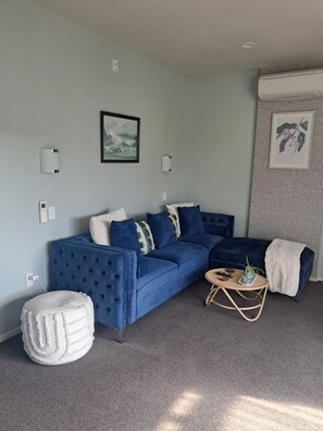 Comfort Apartment | Living area | 42-inch Smart TV with digital channels, Netflix, Hulu