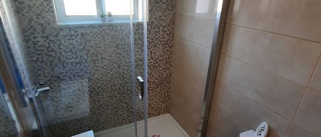 Shower, hair dryer, towels, soap