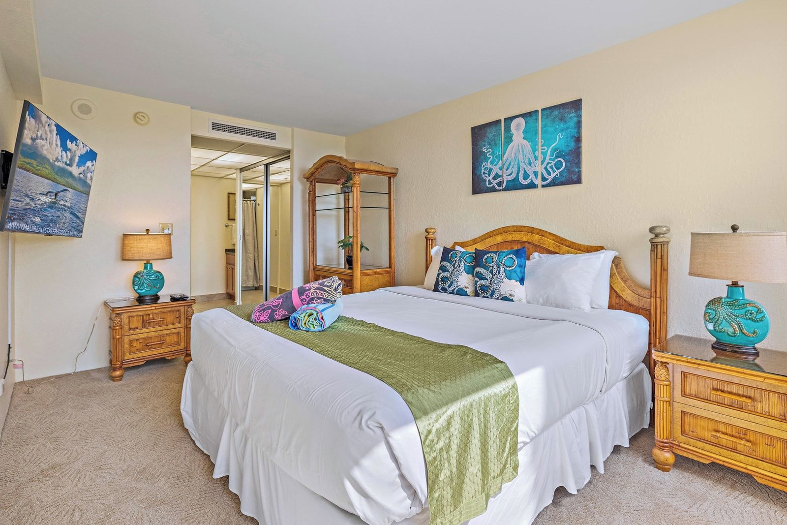 Bright and breezy, this master retreat features ocean hues, a private lanai, and space to unwind in tropical style     KS-535