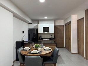 Fridge, microwave, stovetop, coffee/tea maker