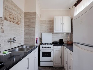 Private kitchen - Fałata Comfort Apartment (Toruń)