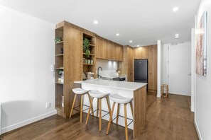 Fridge, microwave, oven, stovetop - Beach Front Bliss - by Furnished Rentals (Auckland)