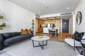 Living, dining and kitchen area - Beaumont Living I 2BR Waterfront Wynyard Apartment (Auckland City)