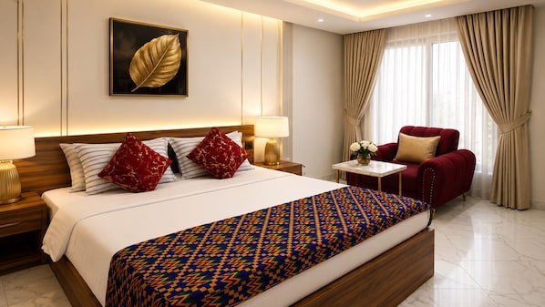 Una habitación de hotel con una cama grande, un sillón rojo, una mesita con flores y una obra de arte colgada en la pared.