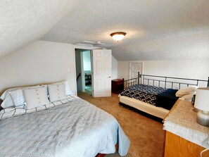 A bedroom with two beds, a nightstand, a lamp, and a ceiling light fixture. - Private 3BR - Minutes to Shenandoah National Park & Massanutten! Bring your Pup! (Shenandoah)