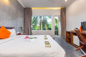 Deluxe Double Room, Balcony, Pool View | Minibar, in-room safe, individually decorated, individually furnished