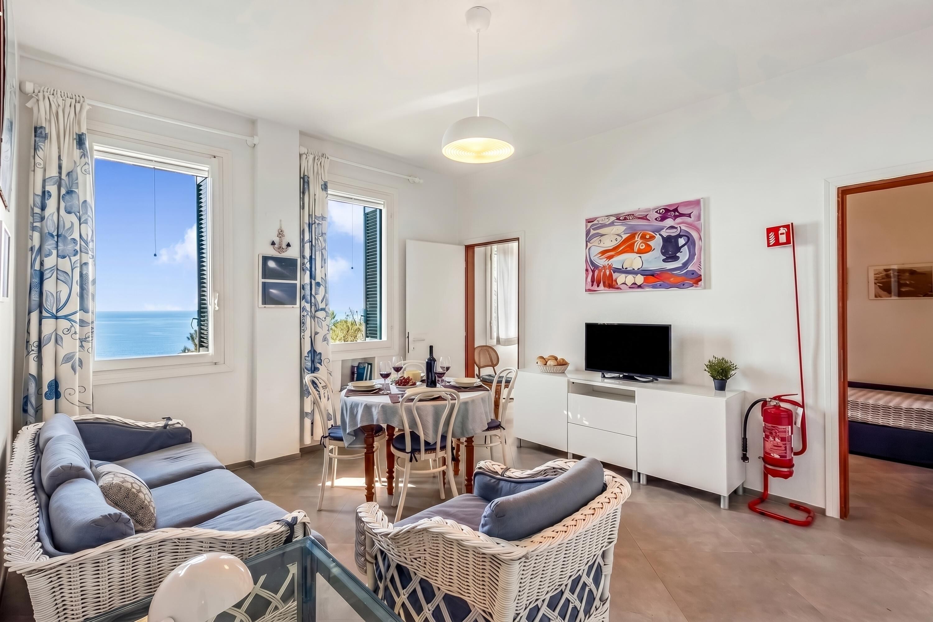 Appartamento Standard, camere multiple, 2 bagni, fronte mare (Appartamento Nel Verde Due Passi Dal) | Area soggiorno | TV a schermo piatto, tavolo da ping pong