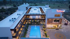 A modern hotel with a rooftop pool, outdoor seating, and a sign reading 'Antaraa'. - La Antaraa  (Tiruchendur)