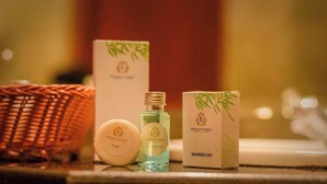 A set of Seethathawa Regency toiletries including a soap bar, a shower gel bottle, and a shower cap. - Seethawaka Regency  (Avissawella)