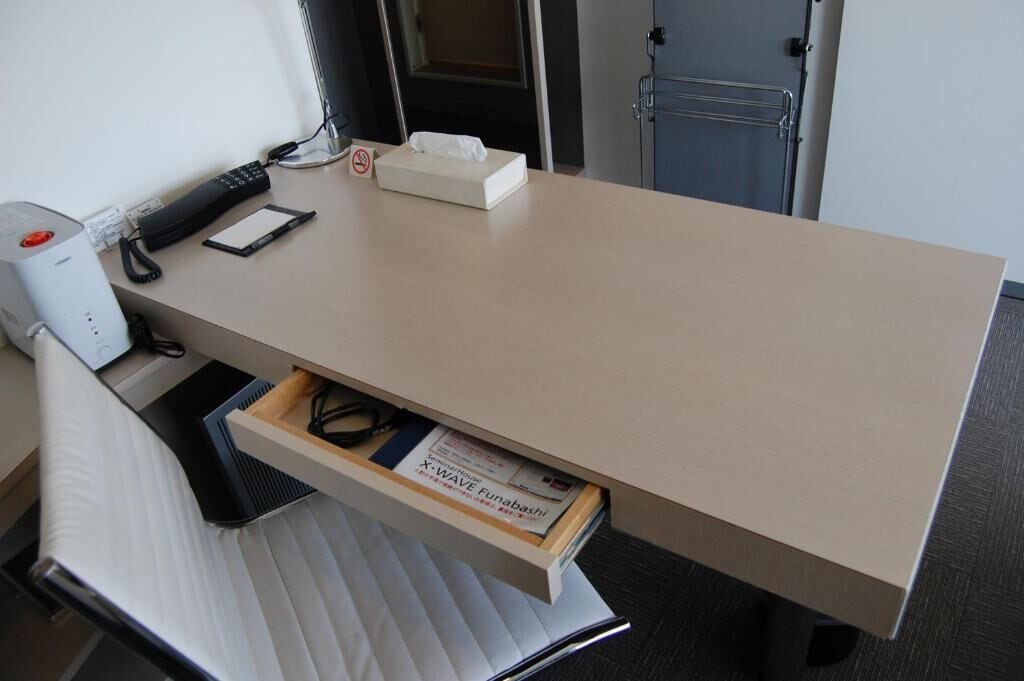 Desk, laptop workspace, blackout drapes, iron/ironing board