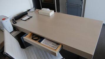 Desk, laptop workspace, blackout drapes, iron/ironing board