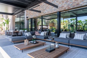 Terrace/patio - New build villa right on the beach with tropical garden and Bali feeling (Cala Vinyes)