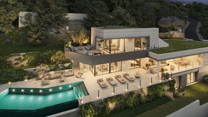 A modern two-story house with a rooftop terrace, a swimming pool, and a landscaped garden.