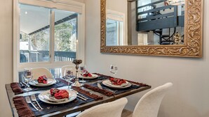A dining table set for four with a mirror above it. - 3 Mi to Keystone Resort: Updated Condo w/ Balcony! (Keystone)