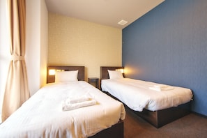 Habitación económica con 2 camas individuales, para no fumadores | Wifi gratis y ropa de cama