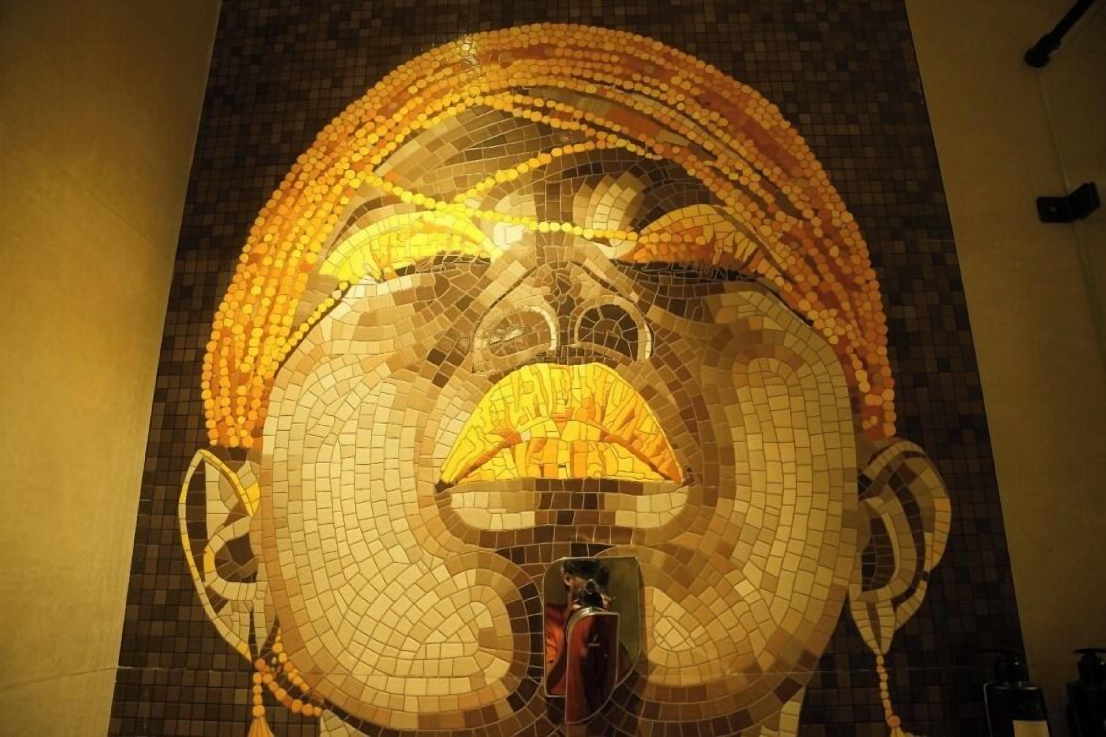 A mosaic artwork on a wall.