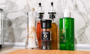 A kitchen counter with various condiments and a salt shaker. - D-Suites – Aristotelous Square Studio, Thessaloniki Centre (Thessaloniki)