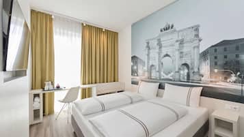 Premium bedding, desk, laptop workspace, soundproofing