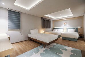 A hotel room with two beds, a desk, a window with blinds, a ceiling light, and a wall-mounted picture. - HotelArrive Seoulful (Seoul)