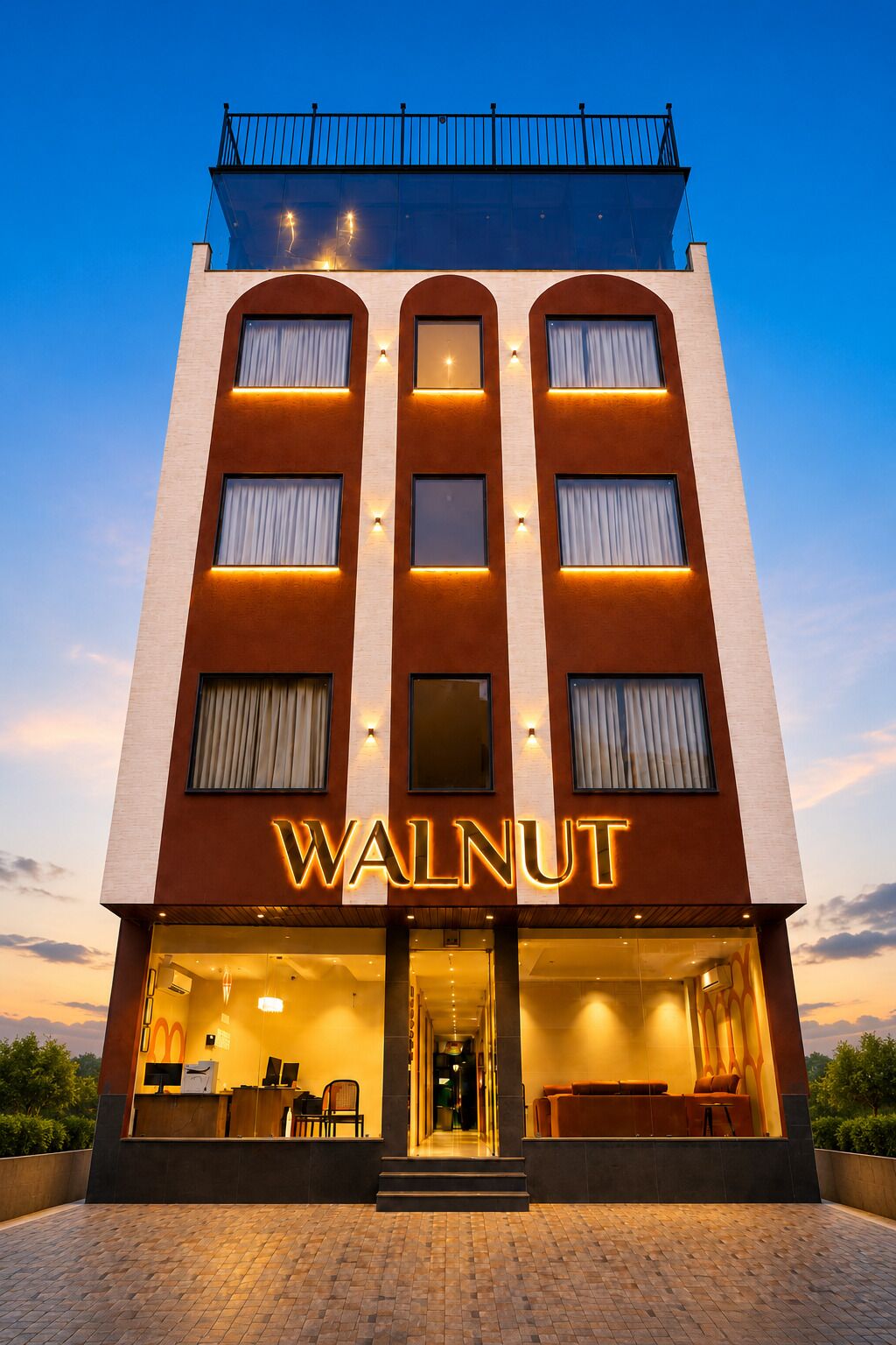 A hotel with a modern facade, a prominent 'WALNUT' sign, and a reception area with a glass entrance.