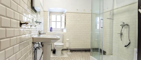 Shower, hair dryer, towels, soap