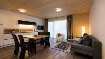 Comfort Apartment, 1 Bedroom, Kitchen | Living area | 35-inch flat-screen TV with satellite channels
