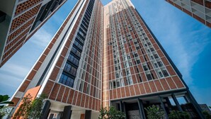 A high-rise building with a modern architectural design, featuring a grid-like facade with visible windows and a clear sky in the background. - The Legacy OUG by Airhost (Kuala Lumpur)