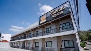 A multi-story hotel with a sign reading 'Hippotel' and a cartoon character logo. - HippoTel Khaorang Phuket Town (Phuket)
