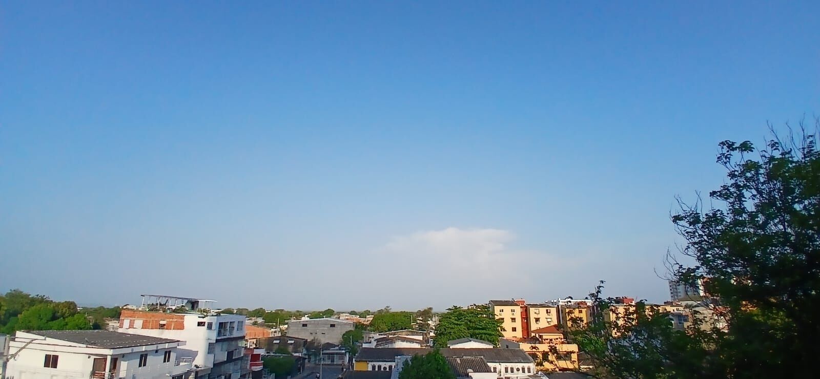 A residential area with various buildings, including houses and apartment complexes.