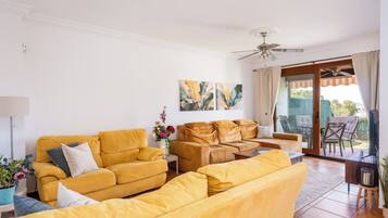 Comfort Apartment, 4 Bedrooms, Hill View, Beachfront | Living area | 40-inch Smart TV with cable channels