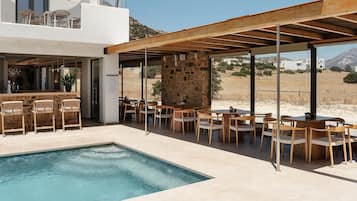 Seasonal outdoor pool, open 11:00 AM to 8:00 PM, pool loungers