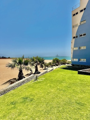 A hotel with a view of the beach and ocean.