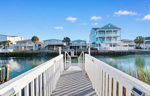Fabulous 4-bedroom channel home with private dock in Cherry Grove Beach.