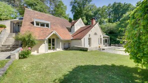 A two-story house with a sloped roof, a front porch, and a stone pathway leading to the entrance. - Guest Room “Entre Loire et Cher” with Private Heated Pool, Private Terrace & Wi-Fi (Faverolles-sur-Cher)