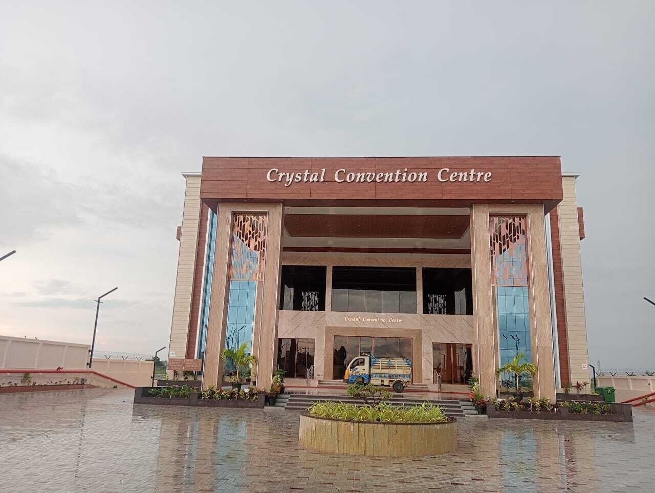 A building with the sign 'Crystal Convention Centre' at the entrance.
