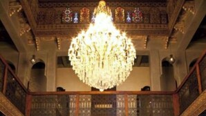A grand hall with a large chandelier, a fountain, and ornate architecture. - kasbah illy (Tifni)