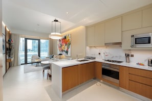 Deluxe Apartment, 2 Bedrooms, Balcony, City View | Private kitchen | Full-size fridge, microwave, oven, stovetop - Address Opera - Mint Stay (Dubai)