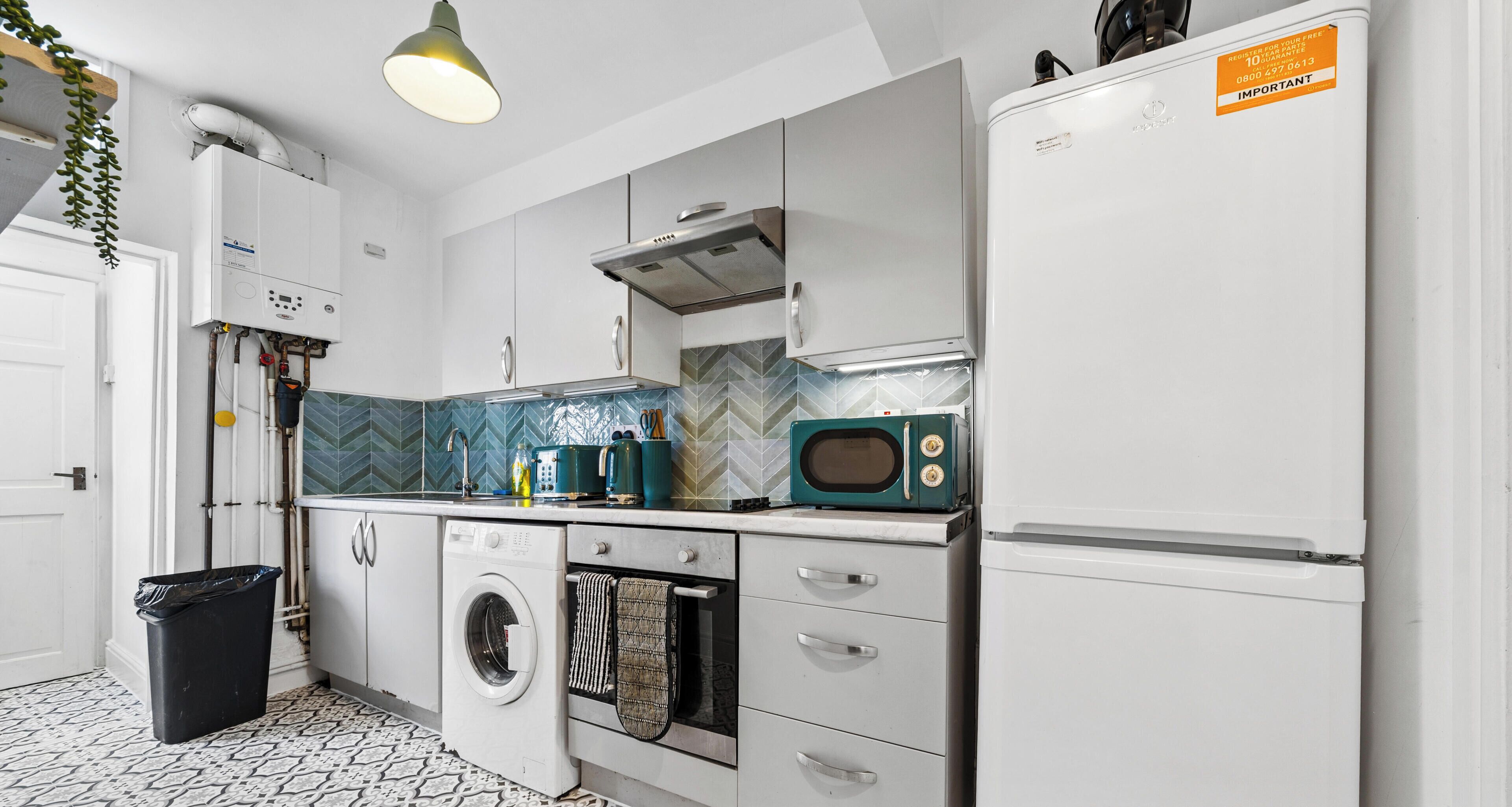 Coffee/tea maker, fridge, microwave, oven