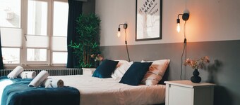 Large group home with 7 cozy bedrooms, sleeps 14+, garden, and air conditioning for a comfortable stay. Features a full kitchen, 4 en-suite showers plus shared bathroom with your guests, multiple toilets, washing machine, and outdoor patio.