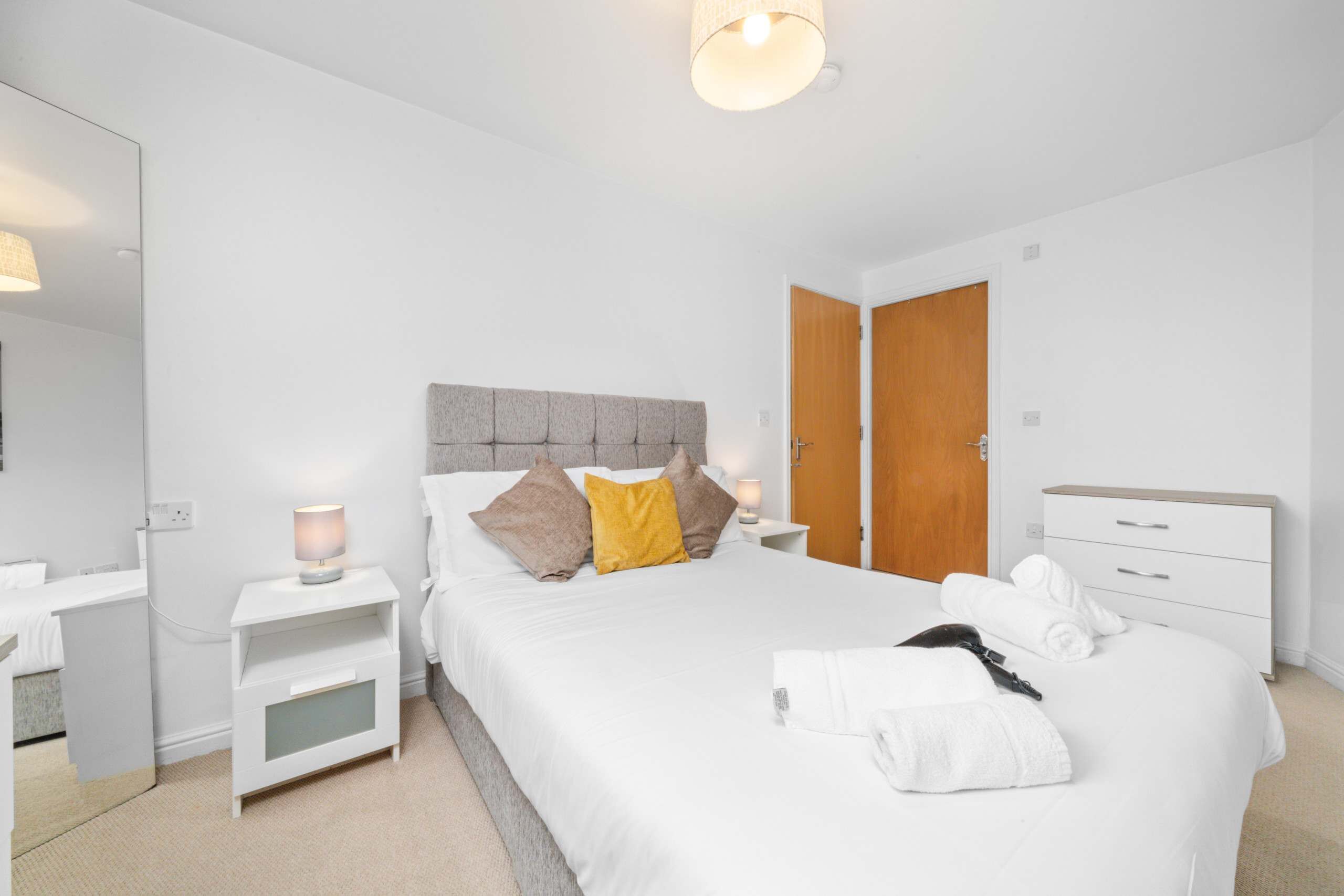 Bedroom Retreat: Bright, inviting room with plush bedding and stylish decor for restful nights!