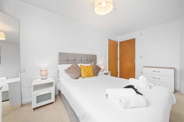 Bedroom Retreat: Bright, inviting room with plush bedding and stylish decor for restful nights!