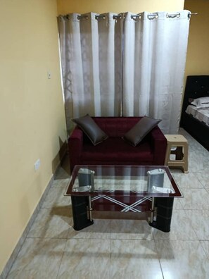 Room, Multiple Bedrooms, Smoking, Balcony | Living room - Room-single Room With a Double bed (Amasaman)