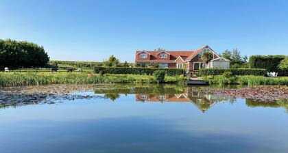 Private 5 Acre Lakeside Family/Large Group Cottage. Quiet Rural Farmside Stay!